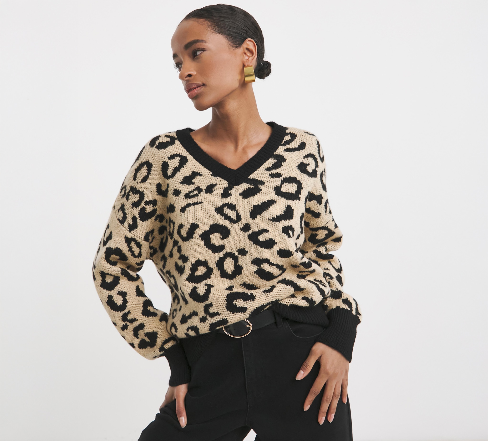 Lady wearing gold animal print v neck jumper