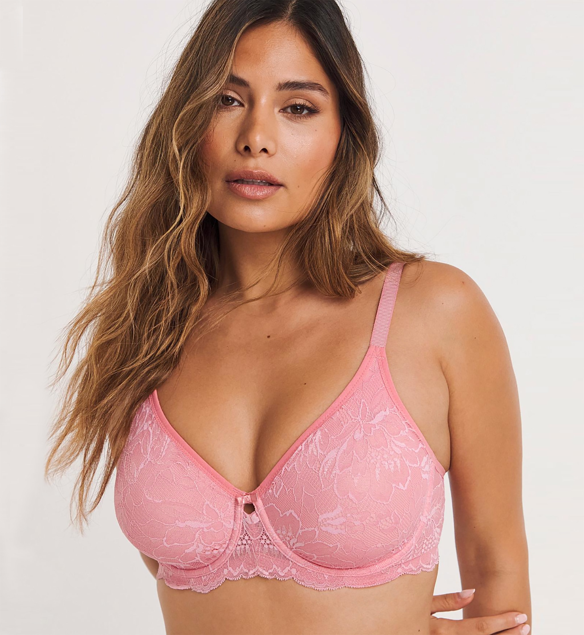 Woman wearing a pink minimiser bra